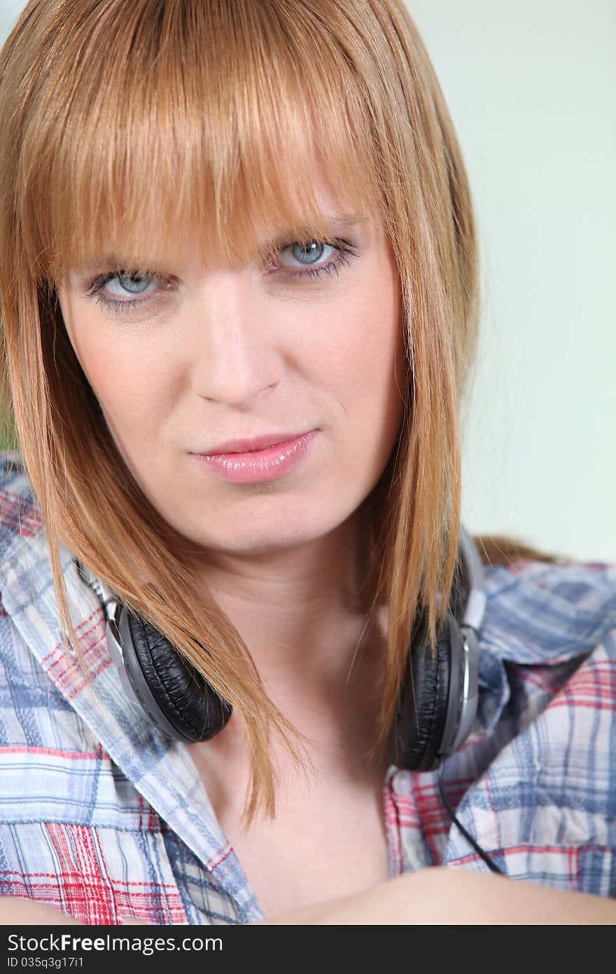 Portrait of a young woman with headphones