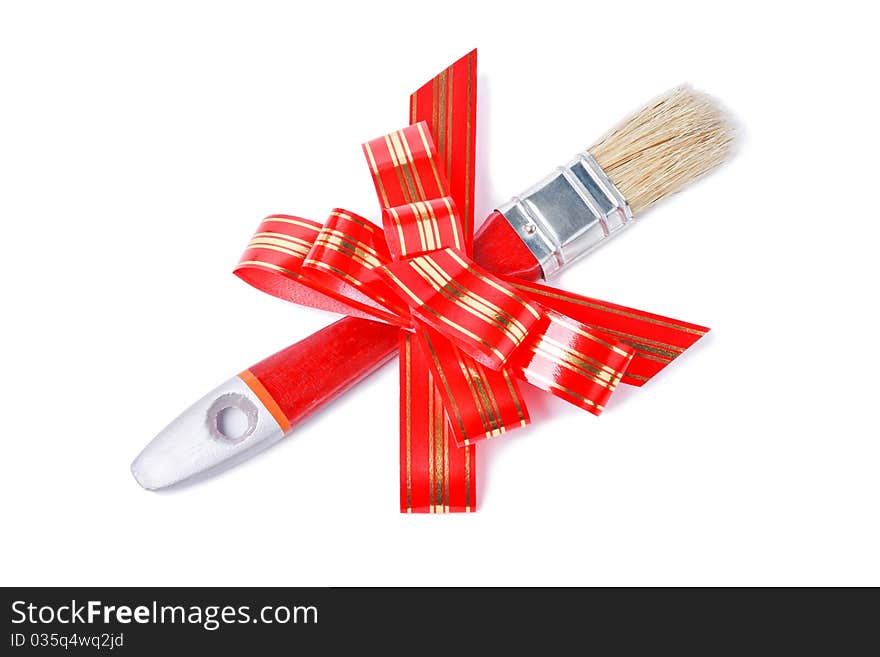 Paintbrush with red goldish striped bow as a gift for painter isolated on white background. Paintbrush with red goldish striped bow as a gift for painter isolated on white background