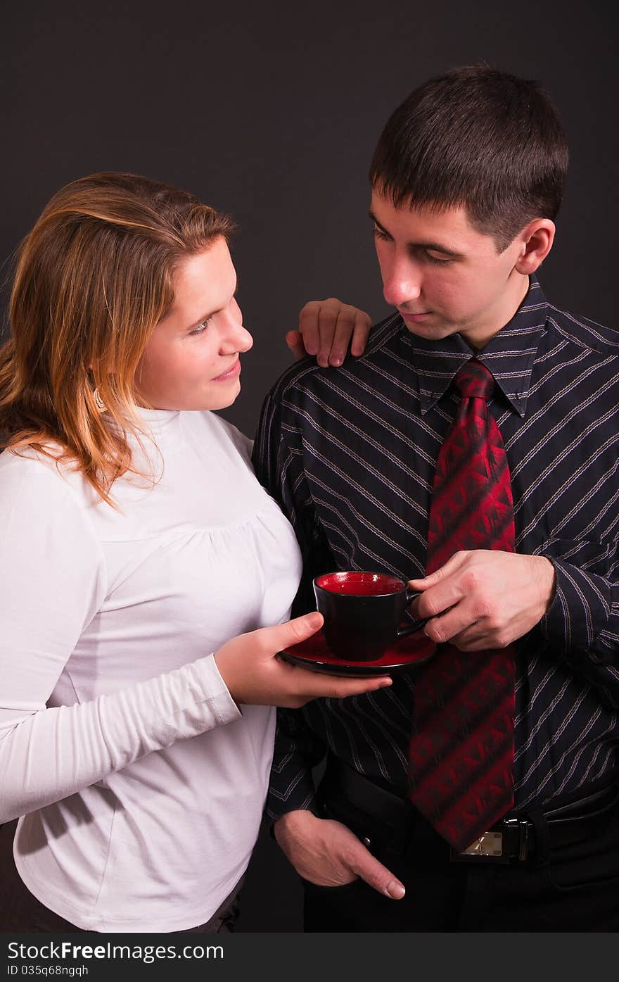 Young business couple (isolated on black)