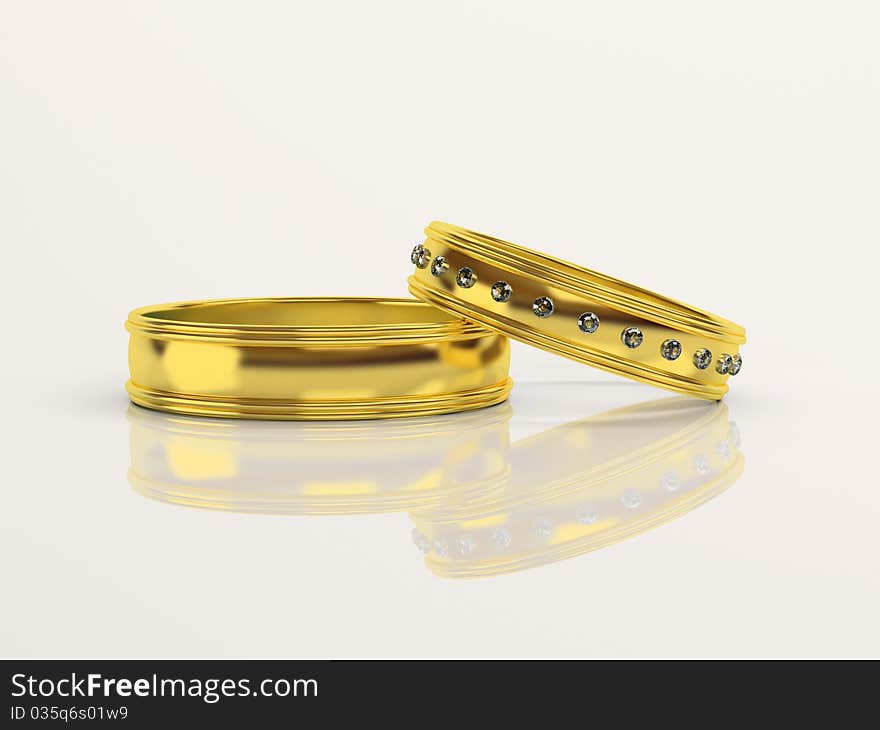 Wedding rings with brilliants on a white background