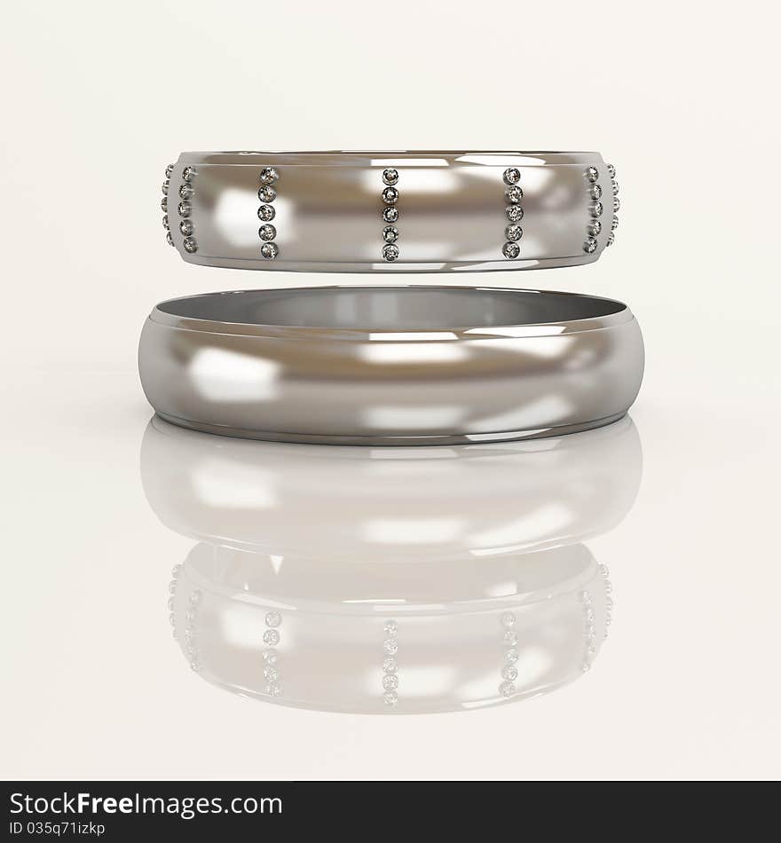 Wedding rings with brilliants on a white background