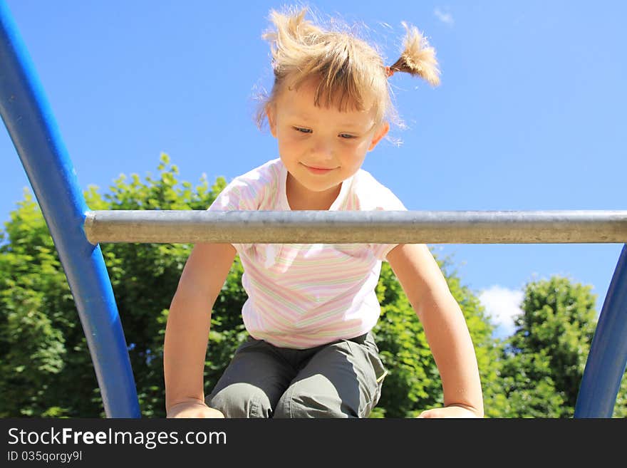 A child enters the ladder on the playground