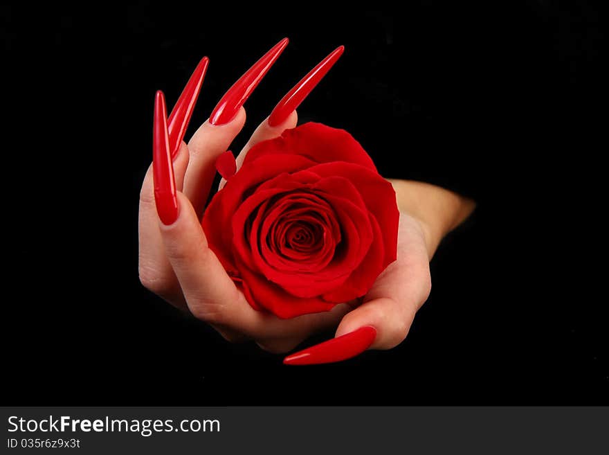 Human fingers with long fingernail and beautiful manicure isolated on black