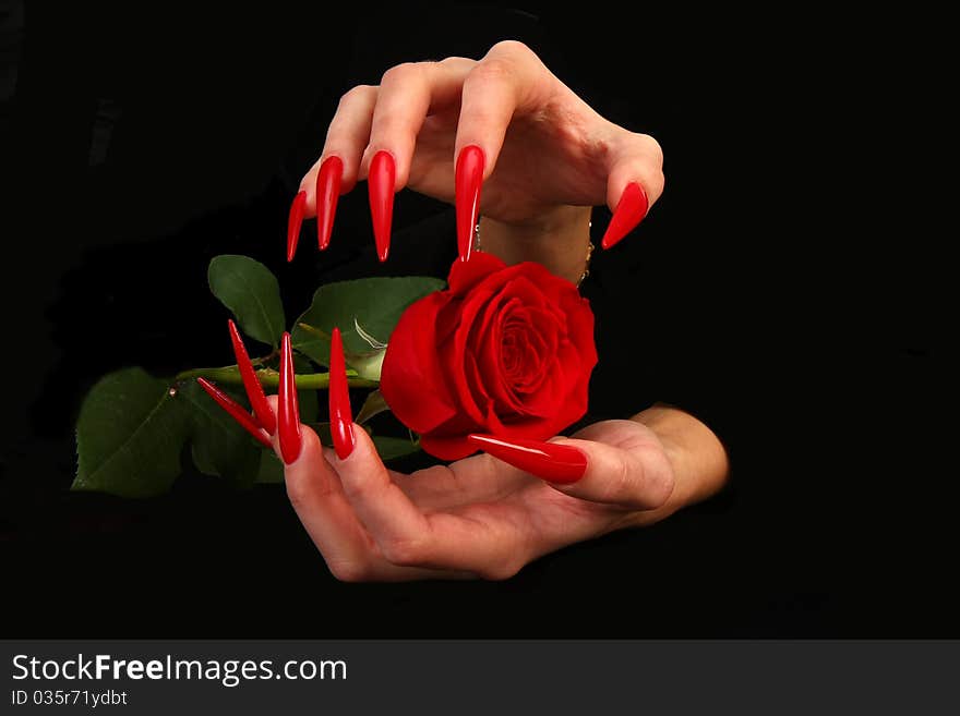 Human fingers with long fingernail and beautiful manicure isolated on black