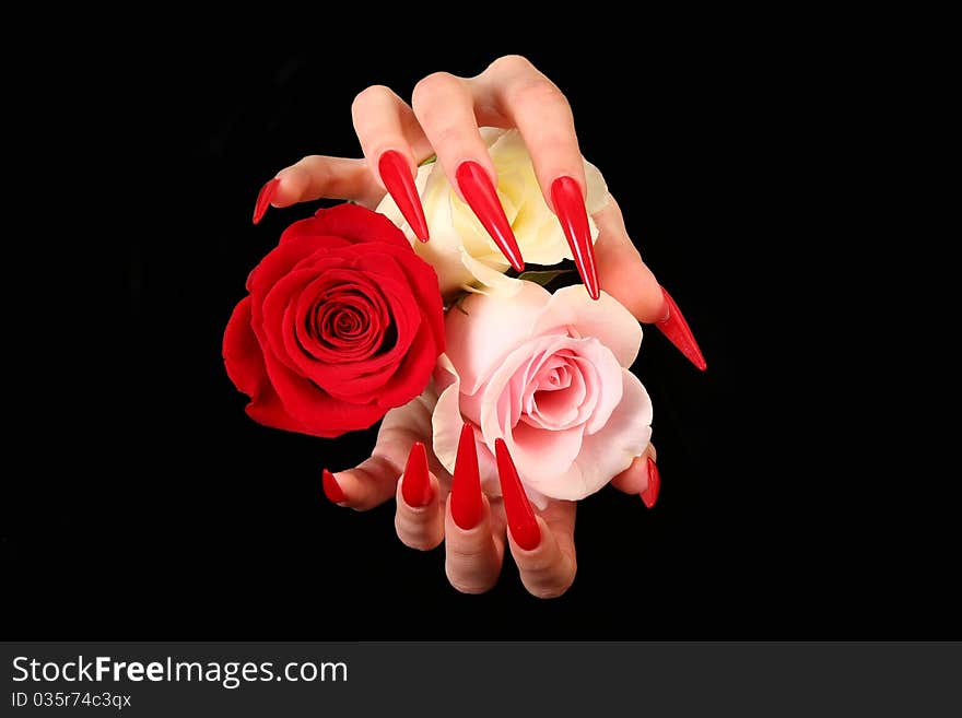 Human fingers with long fingernail and beautiful manicure isolated on black