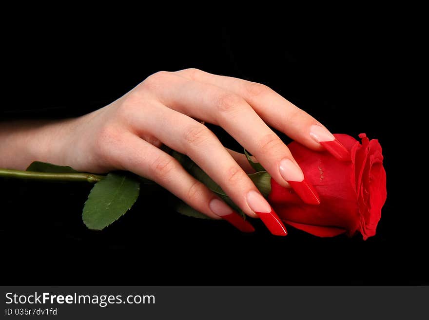 Human fingers with long fingernail and beautiful manicure isolated on black