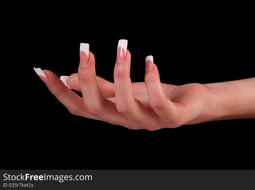 Human fingers with long fingernail and beautiful manicure isolated on black