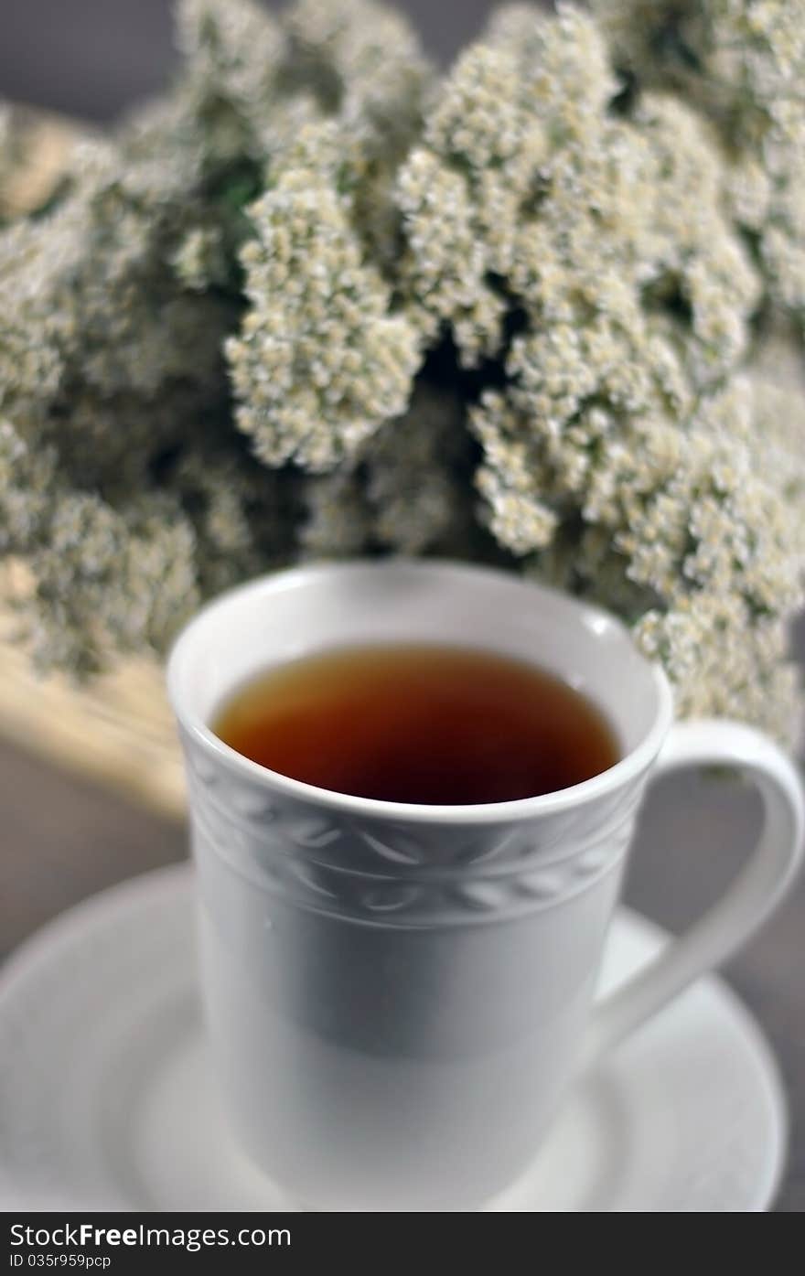 Cup of healing tea and yarrow flowers. Cup of healing tea and yarrow flowers