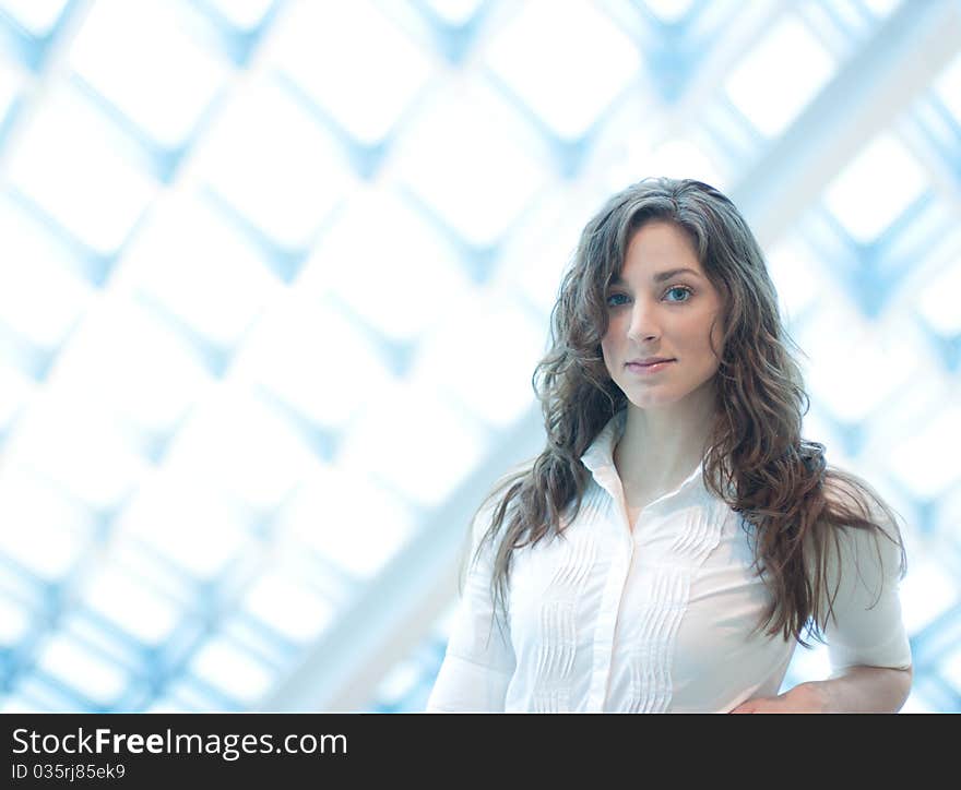 Elegant young woman in library