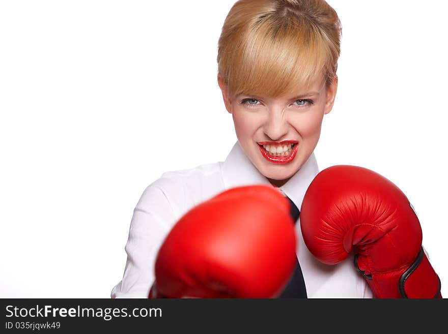 Portrait of beautiful and young business woman wearing boxing gloves. Portrait of beautiful and young business woman wearing boxing gloves