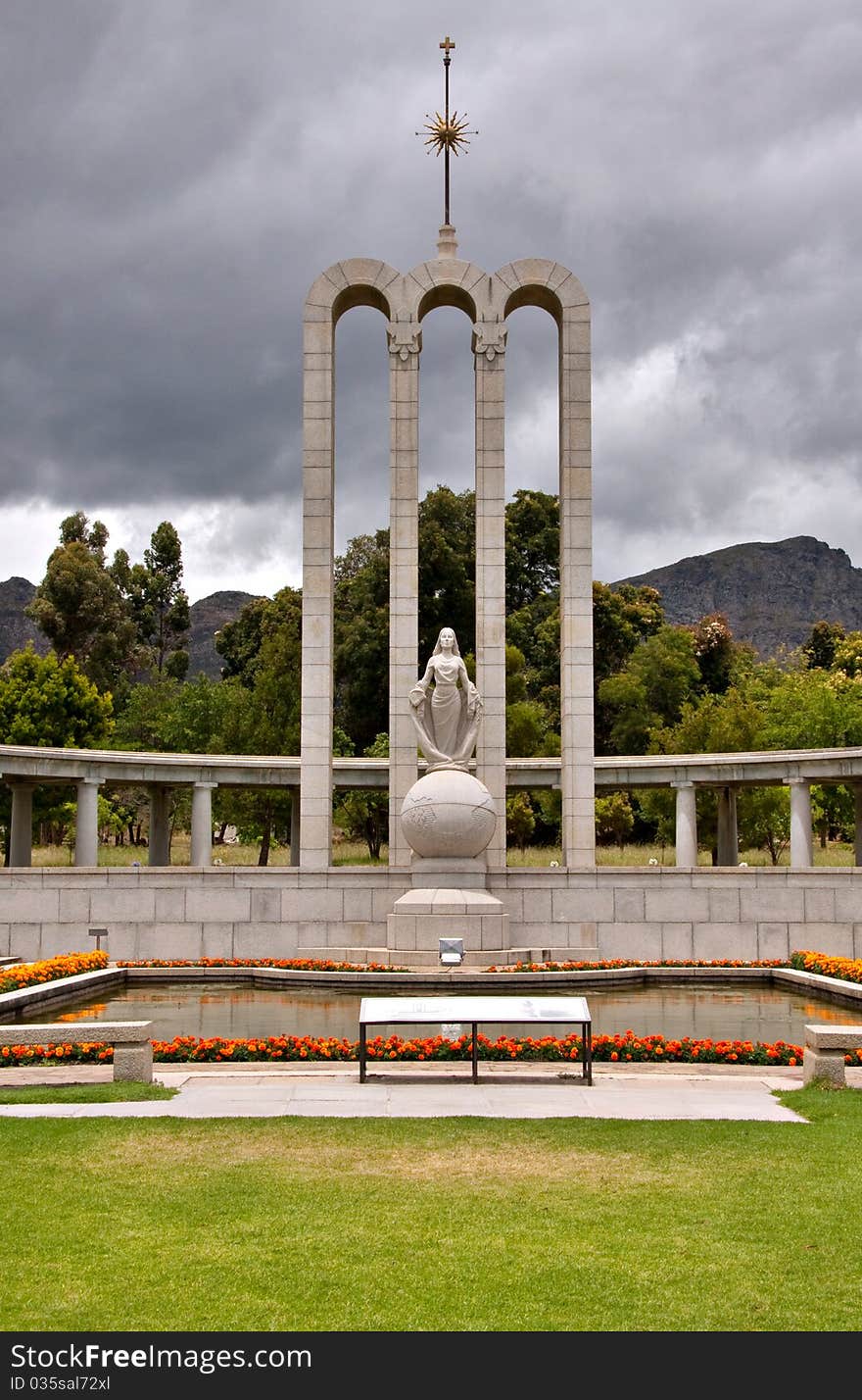 The Huguenot Monument in summer with green grass and blooming gardens in Franschhoek, Western Cape, South Africa. The Huguenot Monument in summer with green grass and blooming gardens in Franschhoek, Western Cape, South Africa