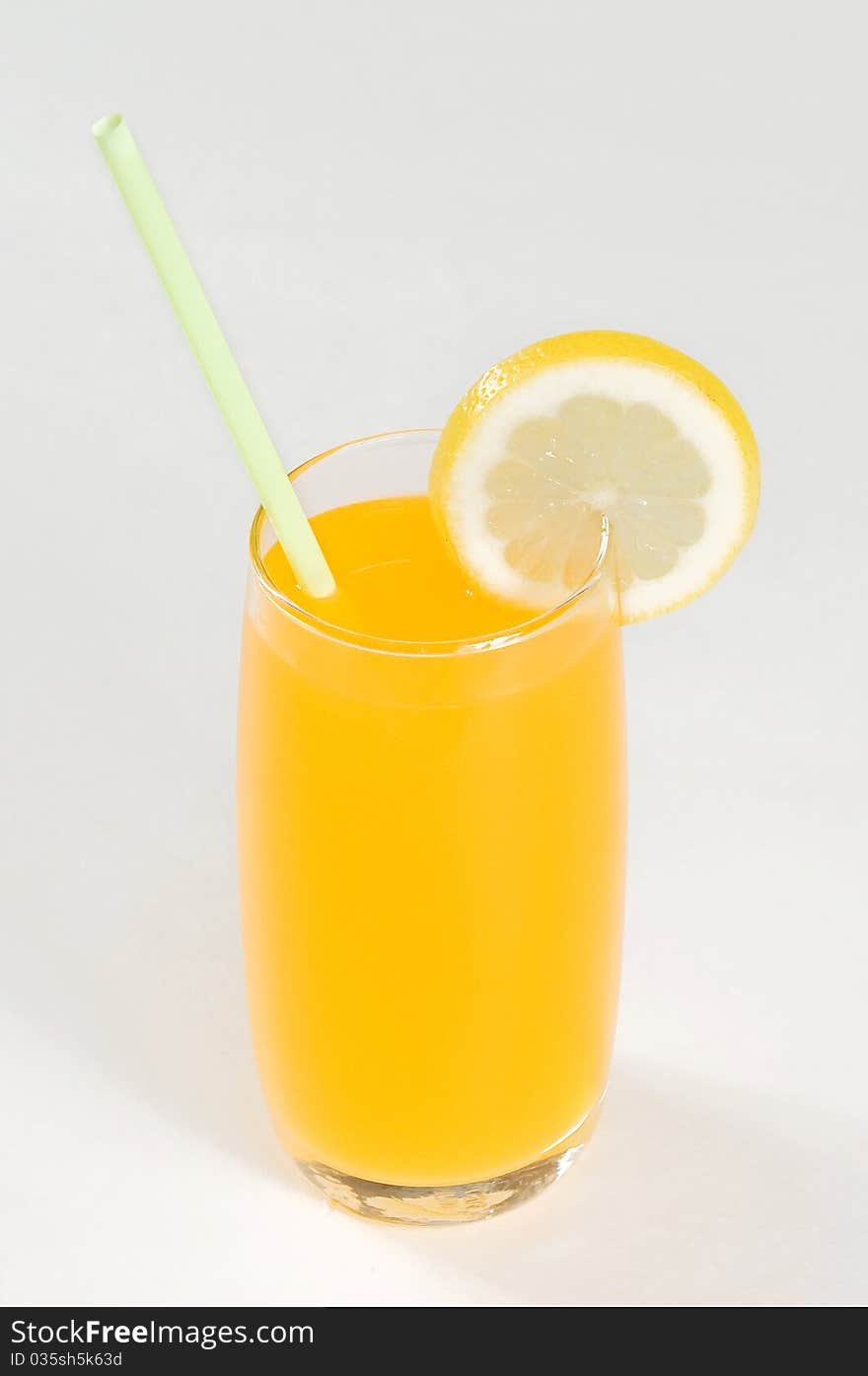 A glass of juice on the table