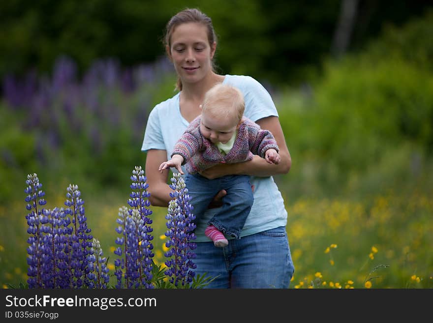 Young Mother & Daughter in Lupine Flowers