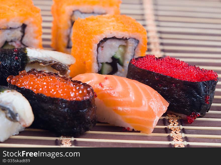 Traditional japanese sushi and rolls close up