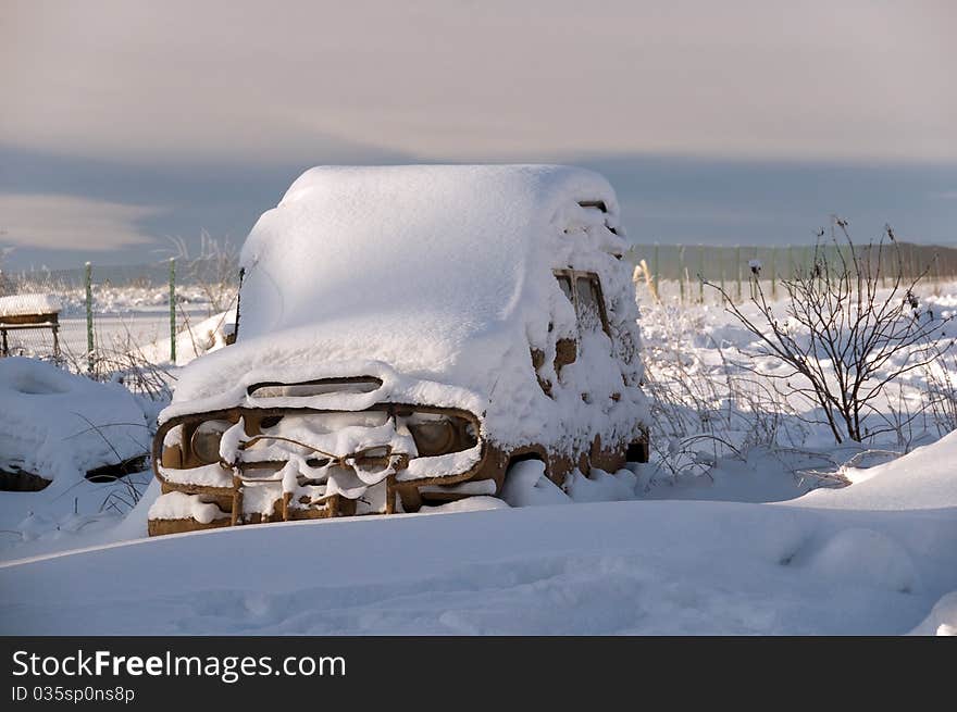 The car brought by snow costs in a snowdrift. The car brought by snow costs in a snowdrift