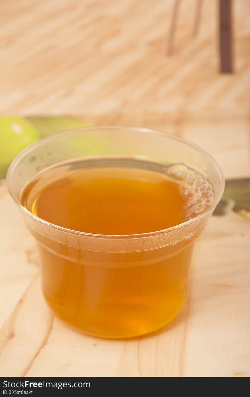 Cup of green tea on wooden table