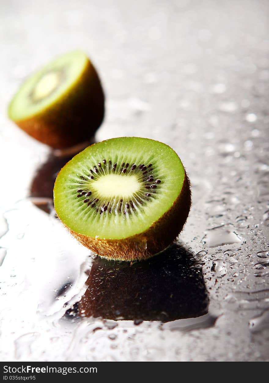 Fresh and wet kiwi with reflection. Fresh and wet kiwi with reflection