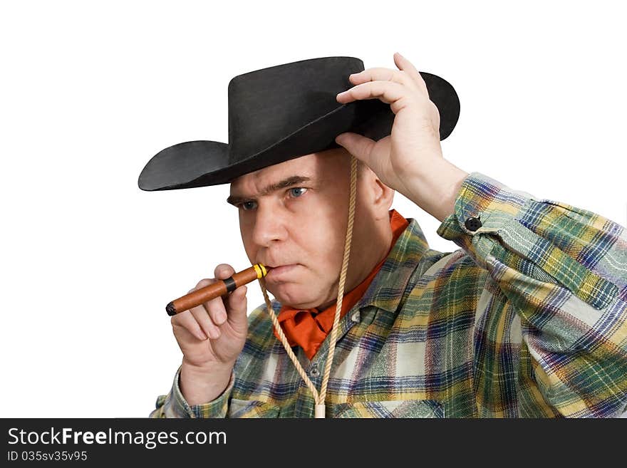 One man in cowboy dress and hat. Shooting in the studio. One man in cowboy dress and hat. Shooting in the studio.