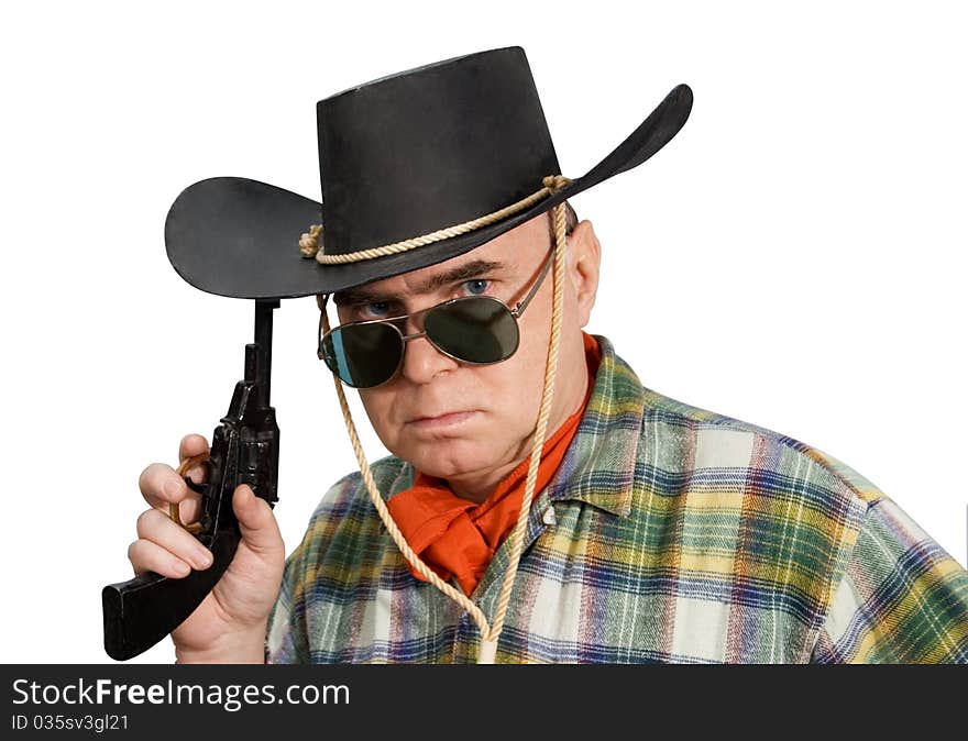 One man in cowboy dress and hat. Shooting in the studio. One man in cowboy dress and hat. Shooting in the studio.