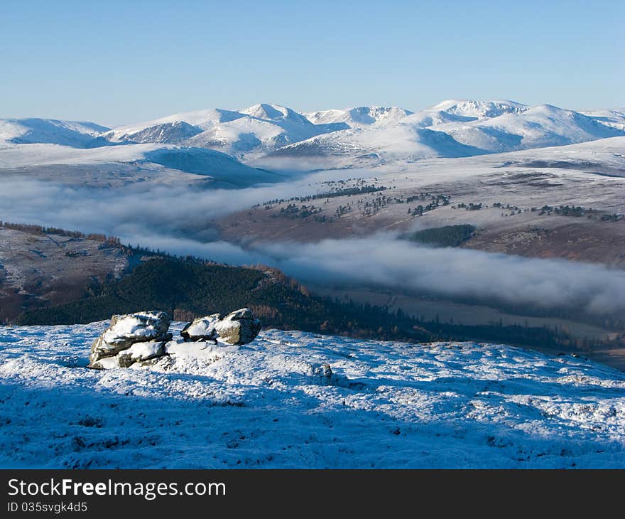 Cairngorm mountains on cold winter day with cloud inversion. Cairngorm mountains on cold winter day with cloud inversion