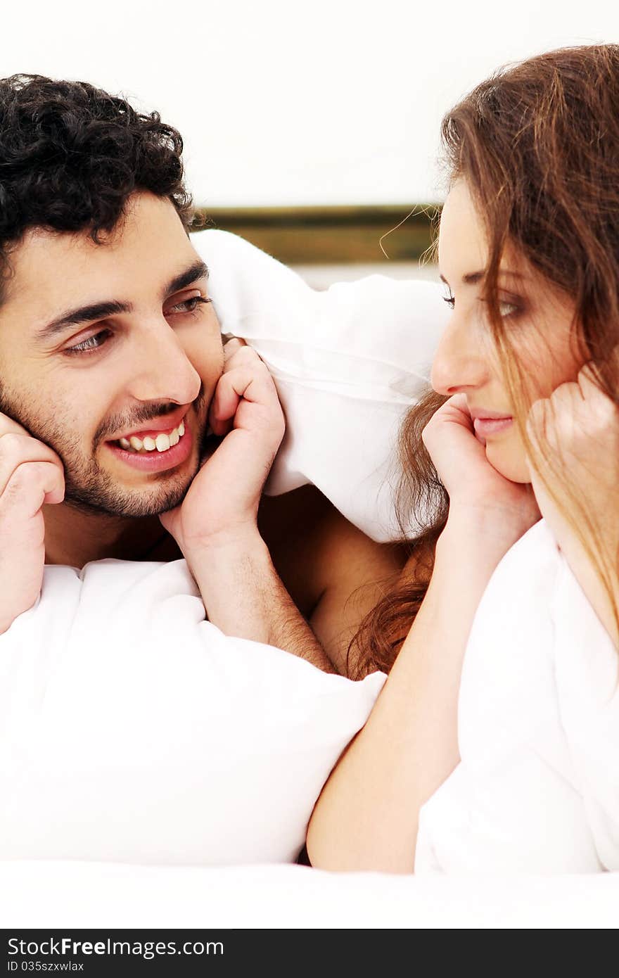 Young and beautiful couple in bed. Young and beautiful couple in bed