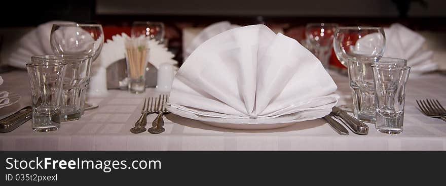 The wedding table is covered in day of celebrating of wedding. The wedding table is covered in day of celebrating of wedding