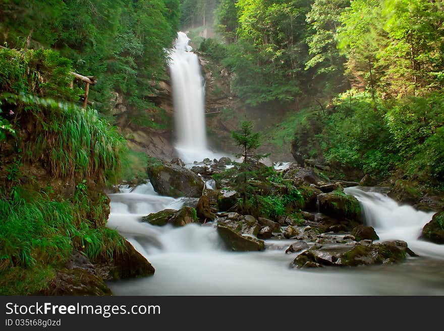 View on waterfall Giessbachfall and green forest, Switzerland