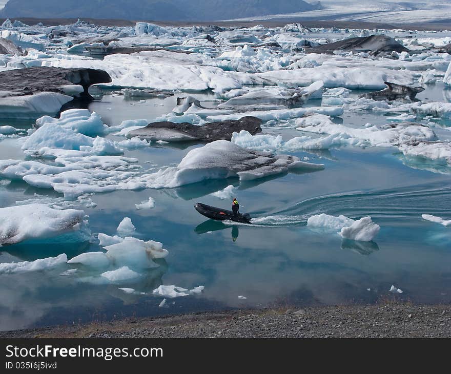 Boat and icebergs at Jokulsarlon glacial lake, Iceland. Boat and icebergs at Jokulsarlon glacial lake, Iceland