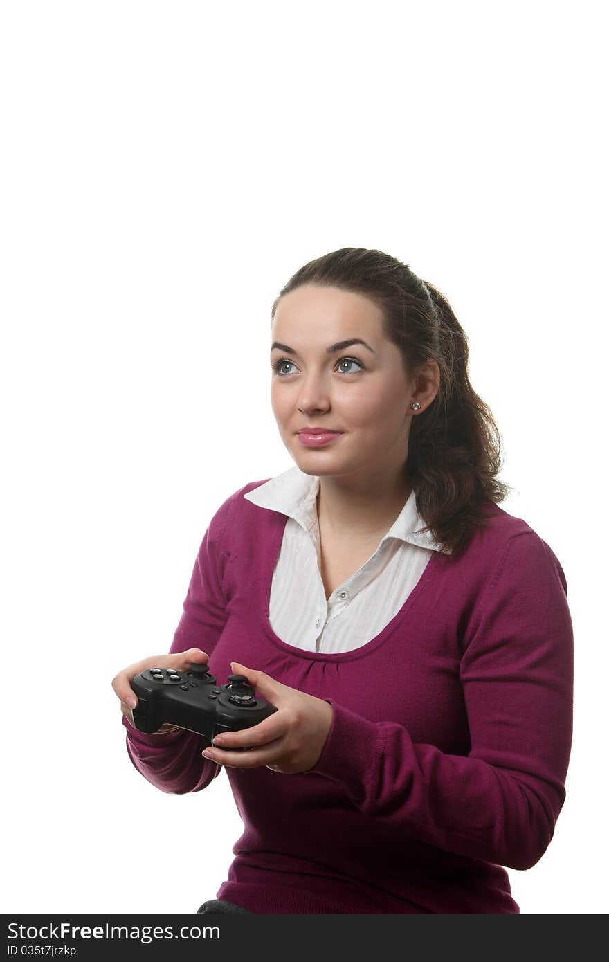 Young women play wideogame by gamepad on the white isolated background. Young women play wideogame by gamepad on the white isolated background