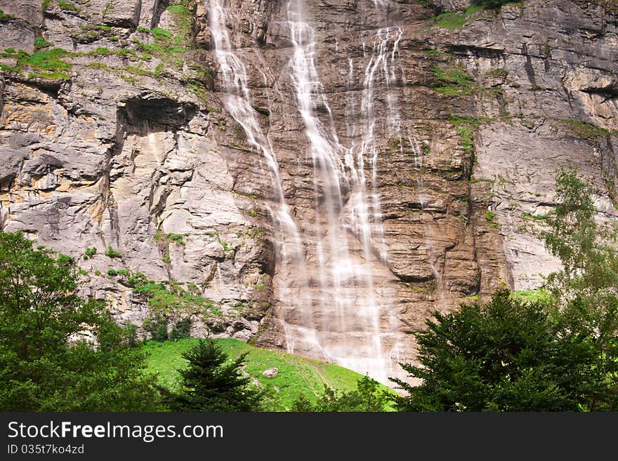 Small waterfall with brown rocks near Lauterbrunnen. Small waterfall with brown rocks near Lauterbrunnen