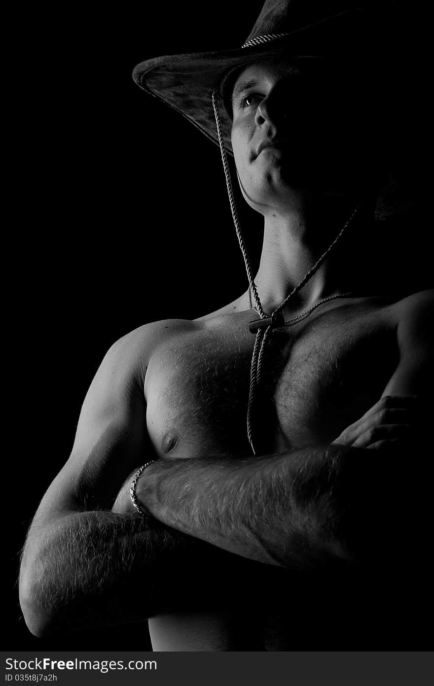 Handsome muscular male on black background