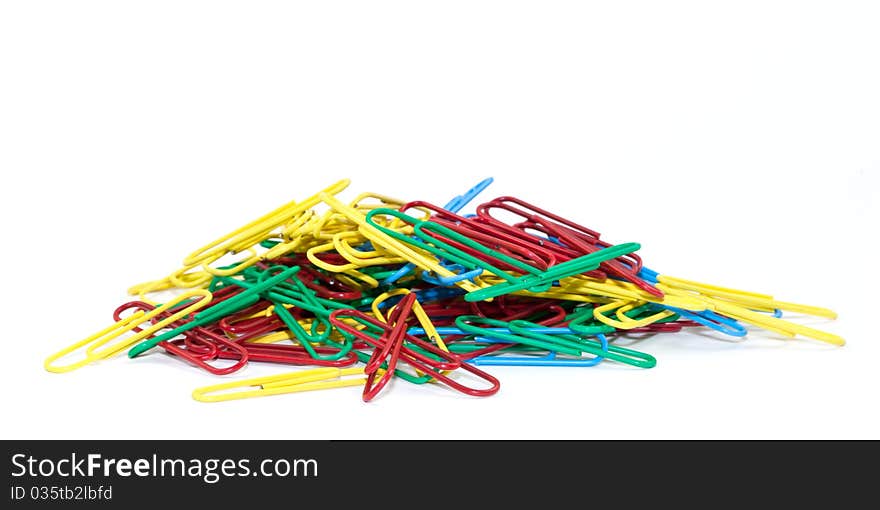 Close-up of multi-colored paper clips isolated on a white background