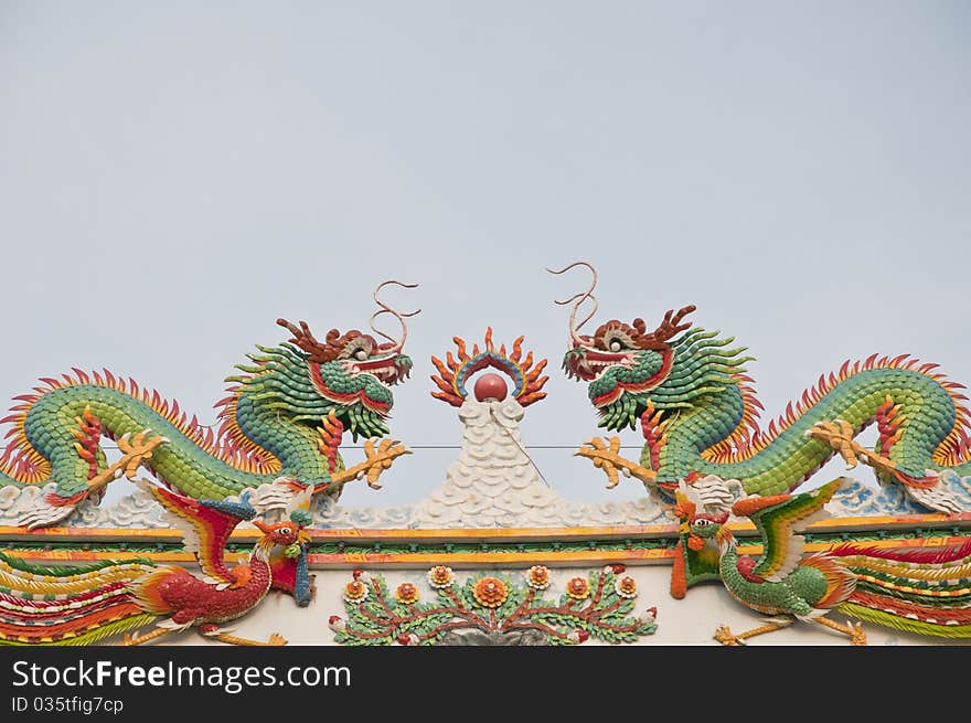 Twin chinese dragon as light blue sky