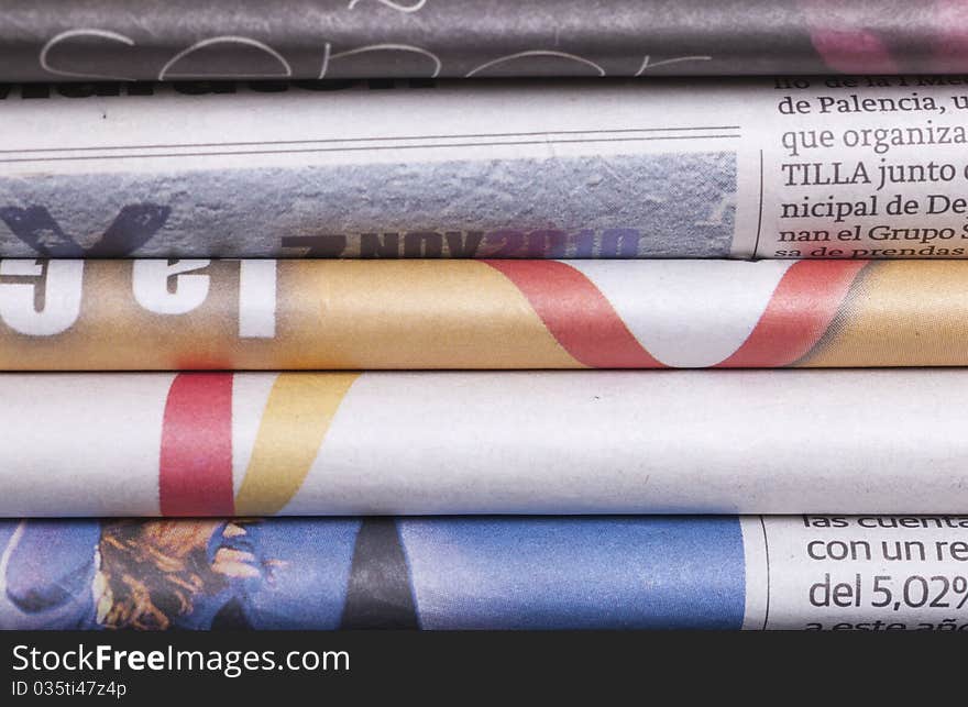 Several folded newspapers and texture background. Several folded newspapers and texture background