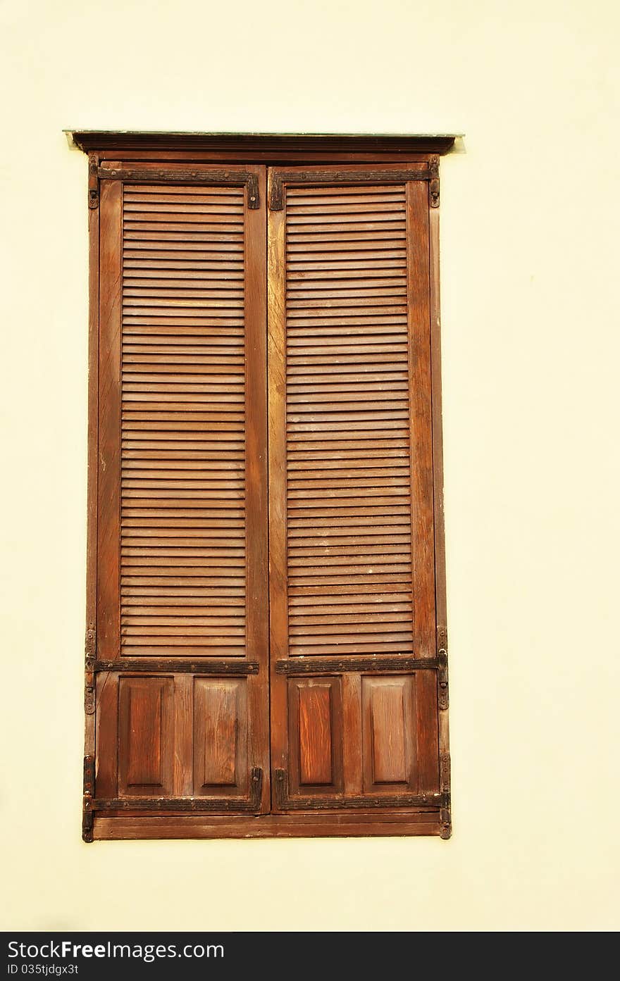 A view of an antique wooden window. A view of an antique wooden window