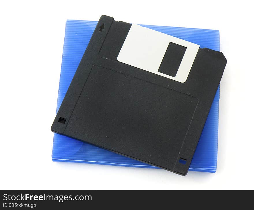 Old floppy disk and a blue atomic disk case isolated on white background. Old floppy disk and a blue atomic disk case isolated on white background