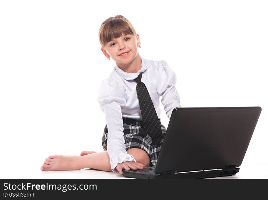 Attractive little girl with laptop isolated