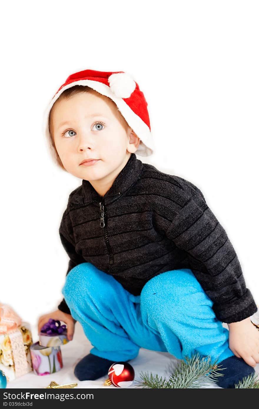 Boy with a New Year's toys isolated on white background