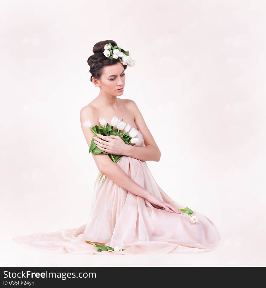 Pretty young woman with spring tulips. Pretty young woman with spring tulips