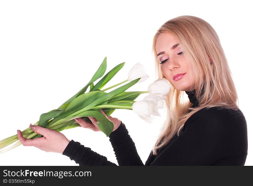 Tender beautiful young woman with tulips