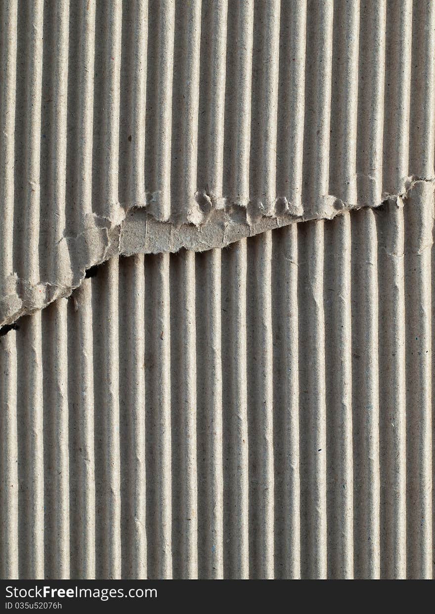 Texture of torn brown paper cardboard