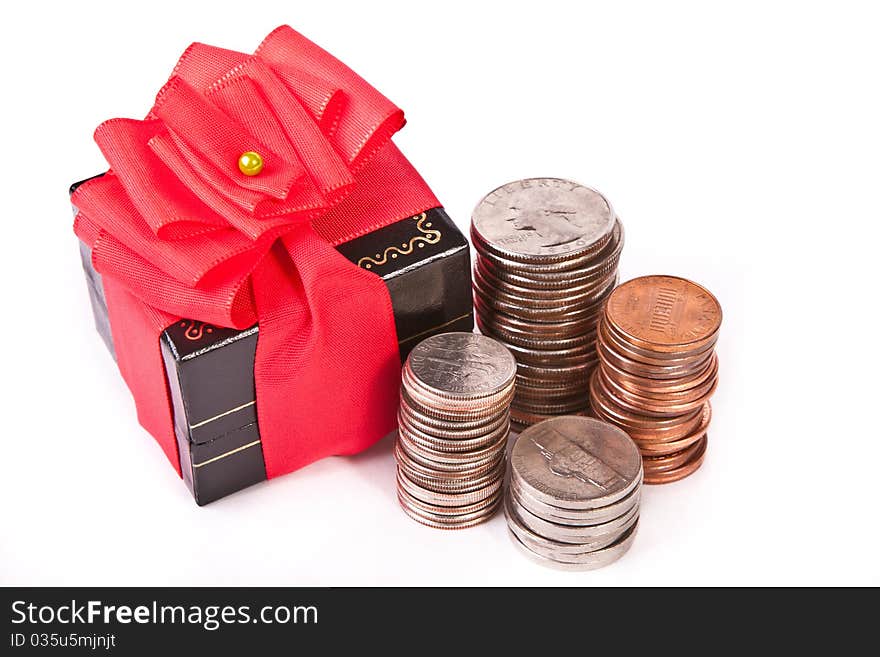 Gift box and a pile of coins