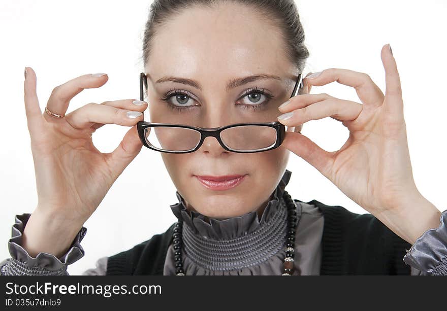 Image of the successful and serious business woman. On a white background.