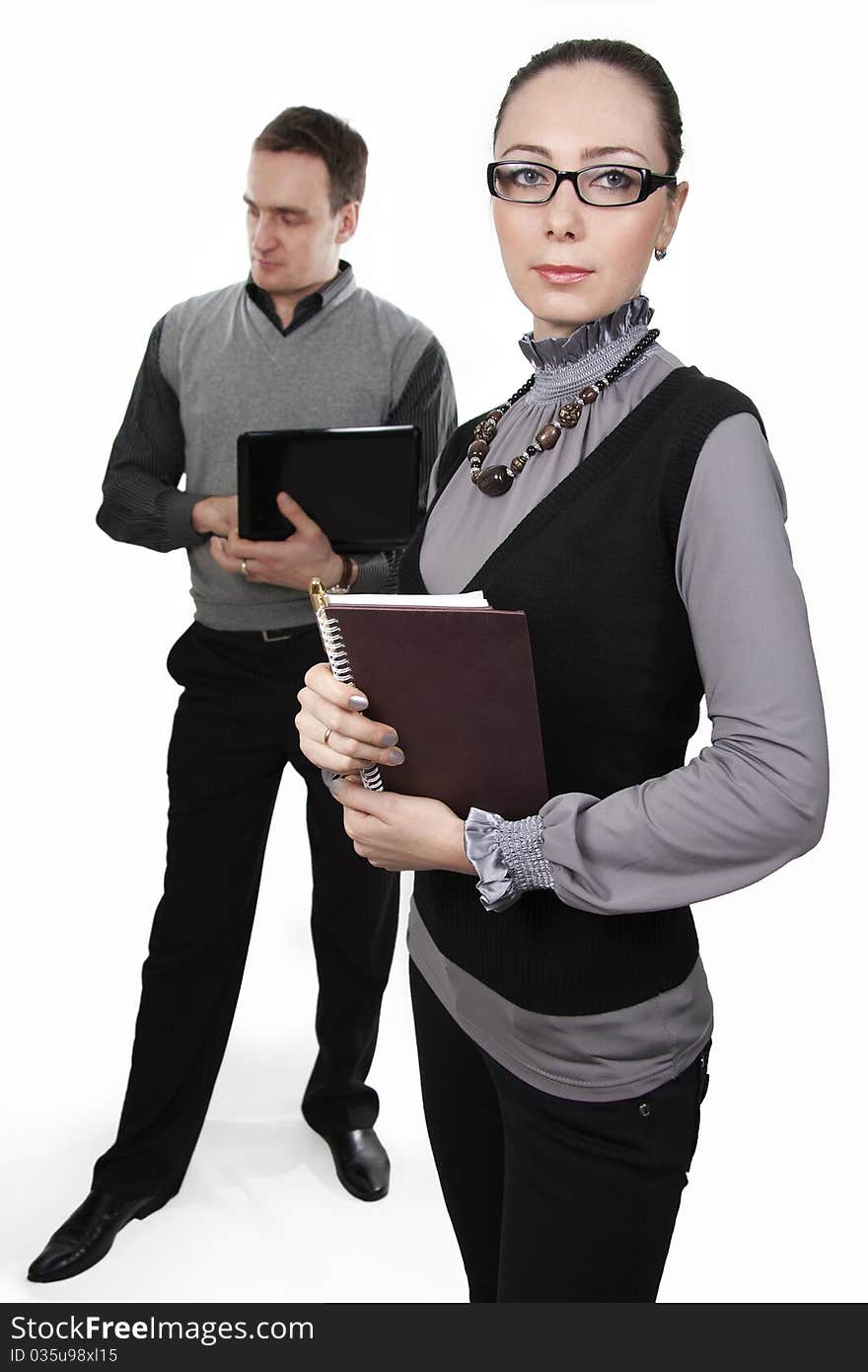 Businessman with the computer and businesswoman at a meeting. Businessman with the computer and businesswoman at a meeting.