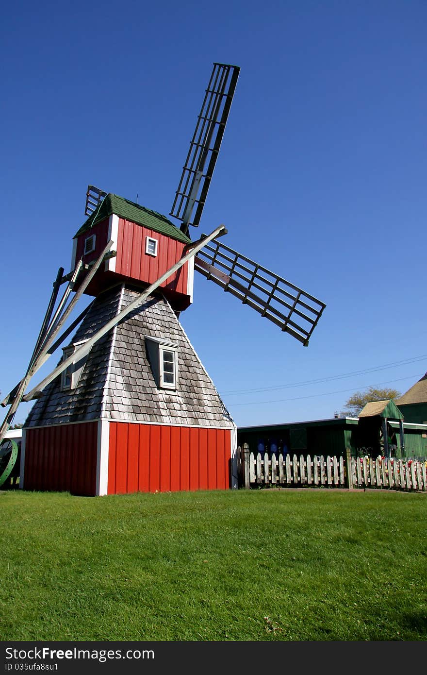 Old dutch wind mill against blue sky. Old dutch wind mill against blue sky