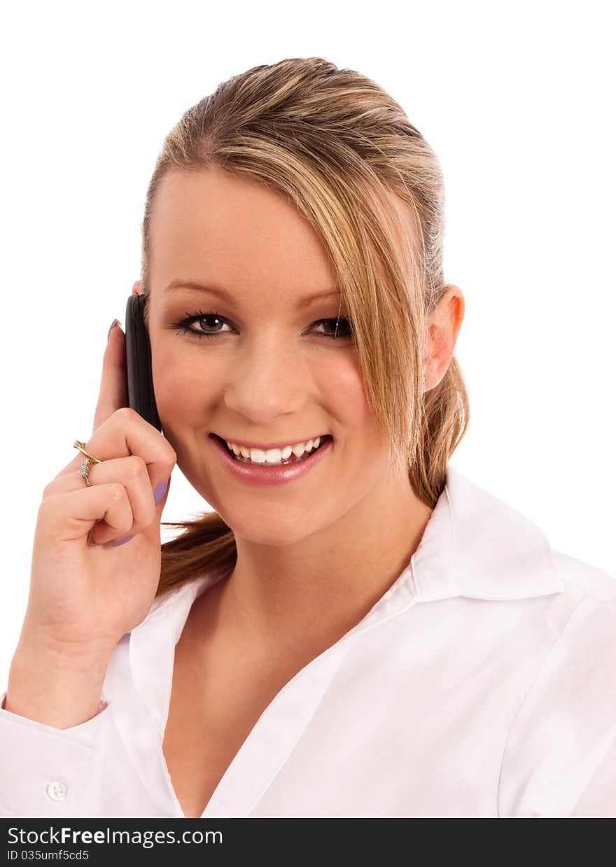 Business woman on the phone dressed in a white shirt