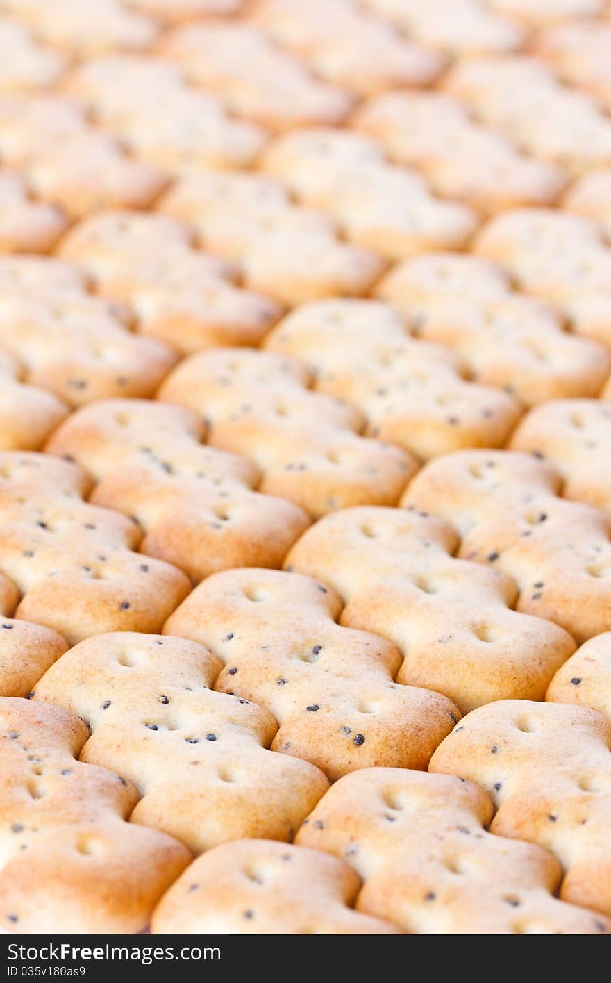 Small shaped browned crisp biscuits as tile background