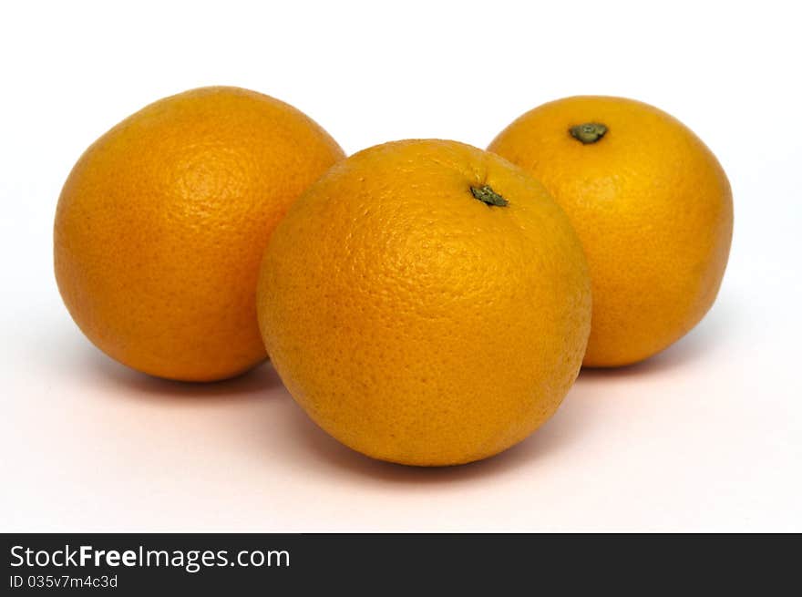 Three oranges isolated on white