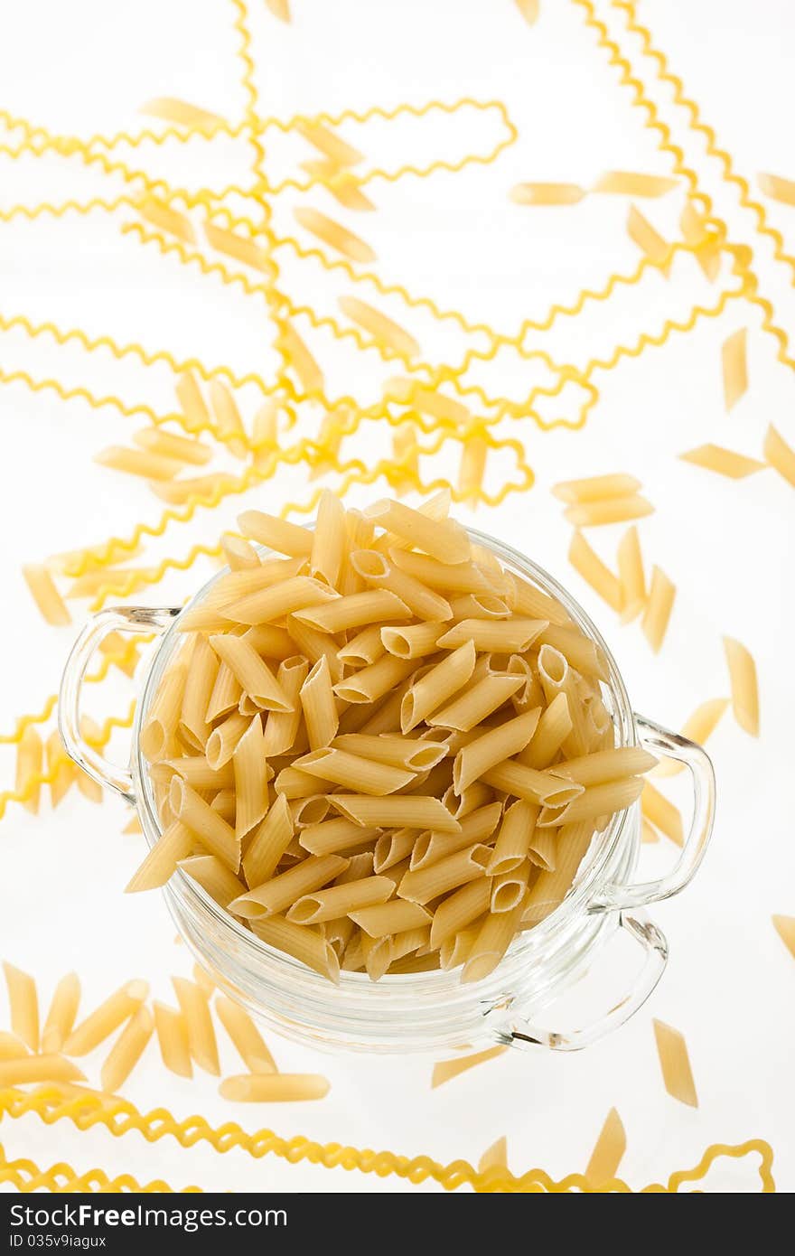 Food series: uncooked pasta in glassy bowl