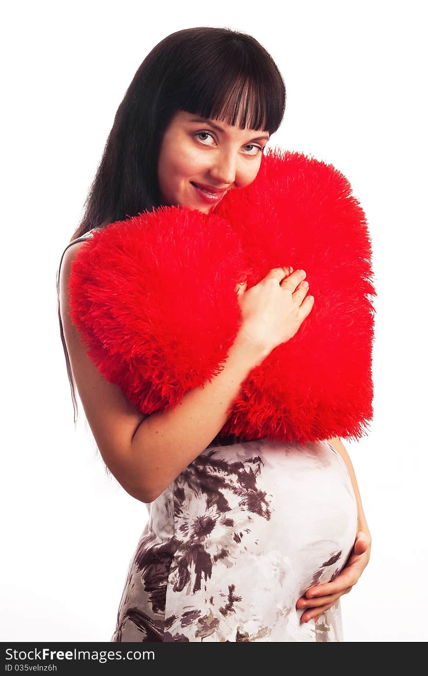 Young Pregnant Girl Hugging A Soft Big Heart